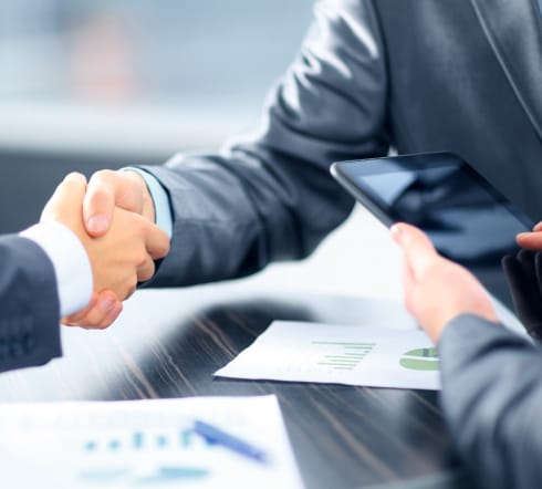 image of two people shaking hands after the purchase of a Surety Bond for their Knoxville, TN Business.